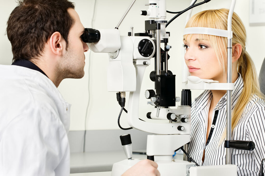 woman is getting her eyes checked 